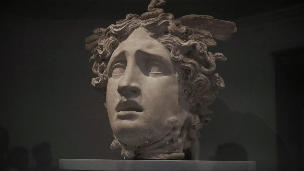 Marble bust of a sorrowful mythological figure