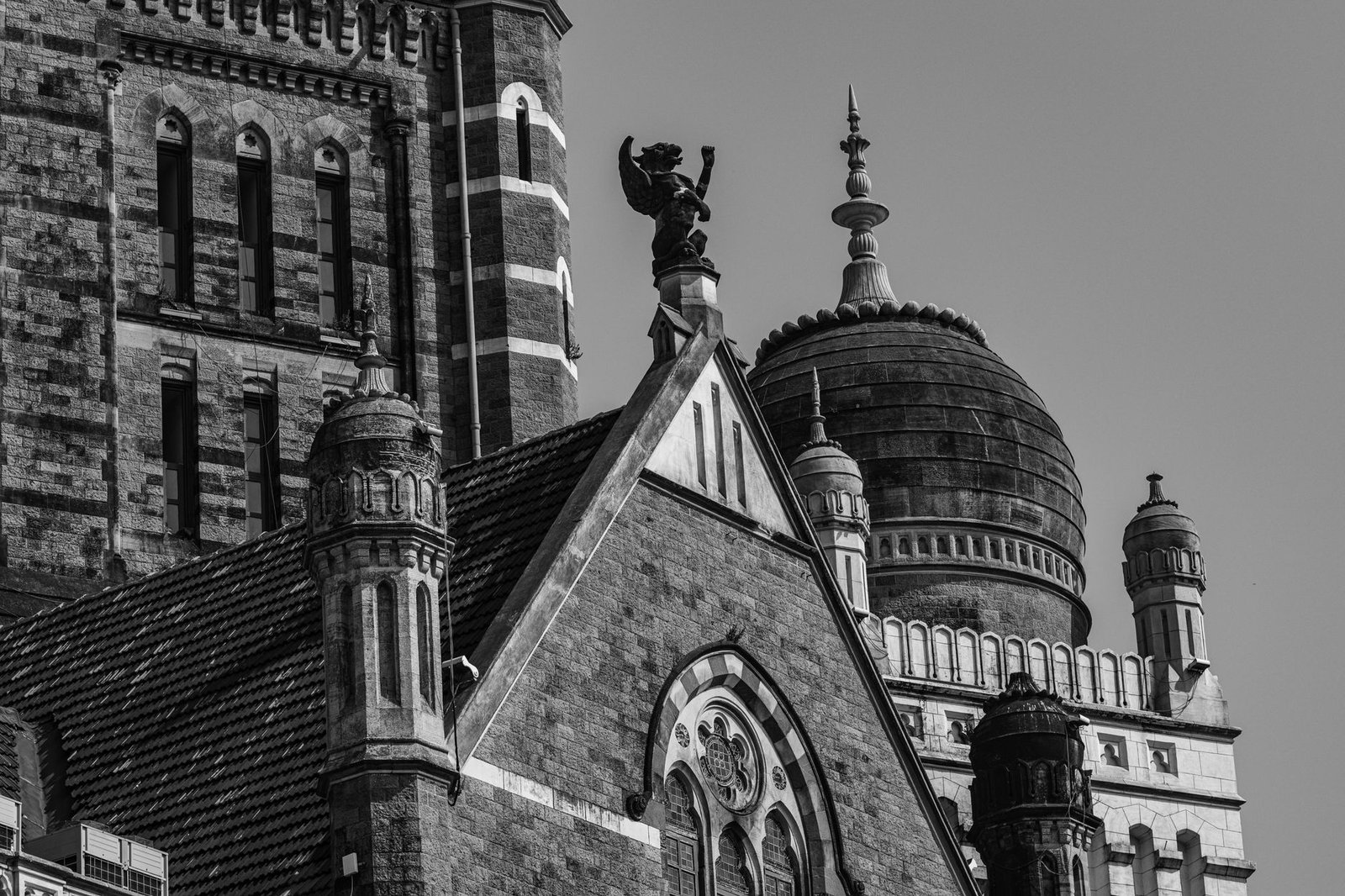 Black and white photo of historic buildings with intricate domes and spires, evoking the Boundary Stone of Terminus