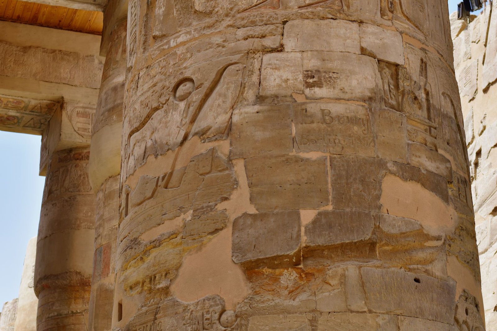 Weathered stone pillar carved with ancient Egyptian hieroglyphs, evoking Cadmus and the founding of Thebes