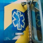 Medical emergency symbol on the side of an ambulance, featuring a caduceus with wings and two snakes