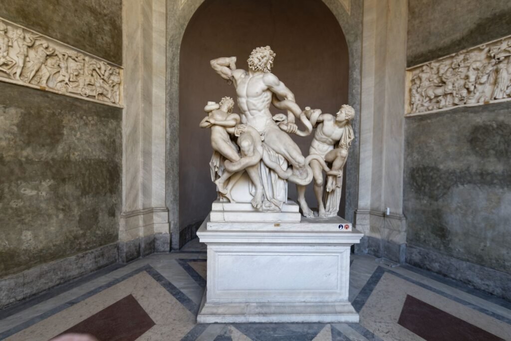 Marble sculpture of Laocoön and his sons entwined with serpents in a classical museum gallery