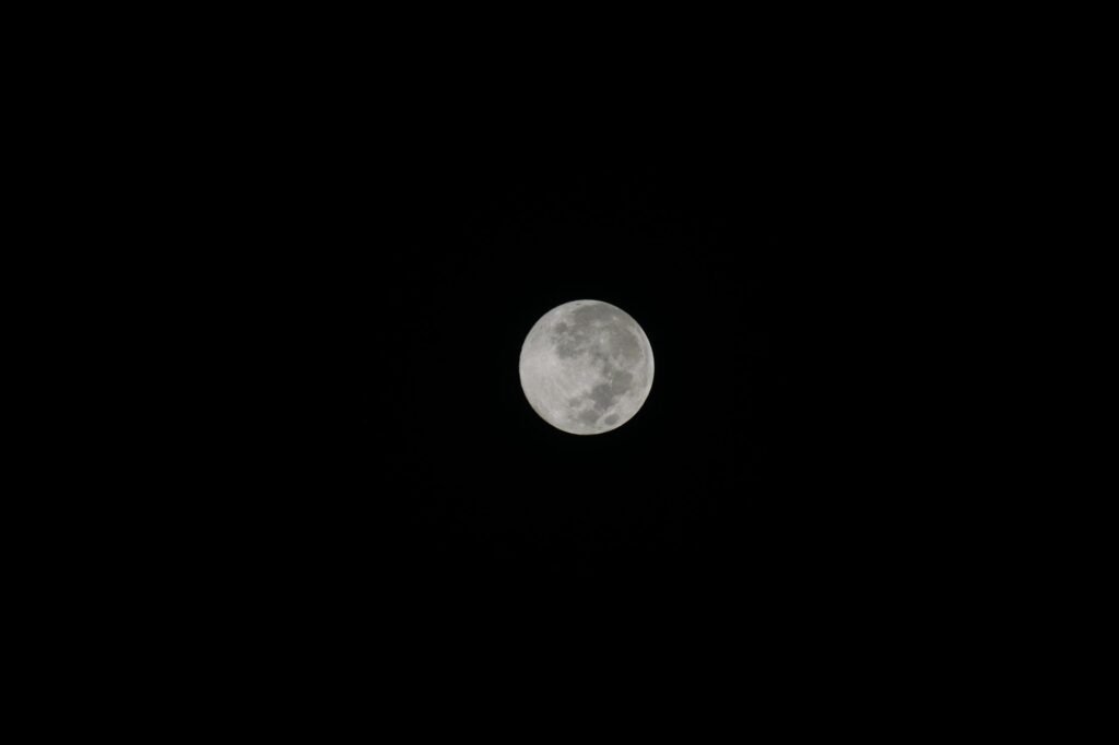 Bright full moon glowing in a clear night sky, symbolizing Selene watching over Endymion.