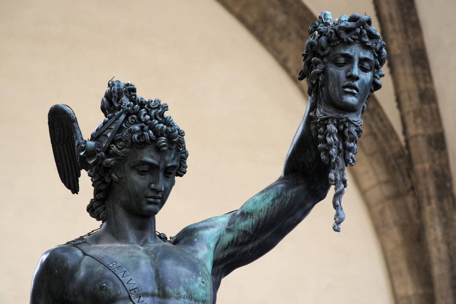 Close-up of Perseus statue holding Medusa’s head in Florence, Italy, with the gorgon head prominently displayed