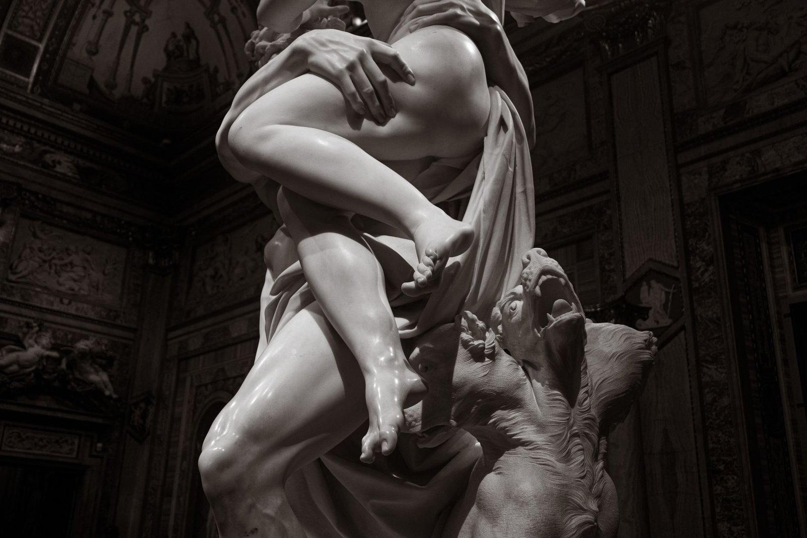 Close-up of Giambologna’s marble sculpture with intertwined figures, illustrating classical mythological drama