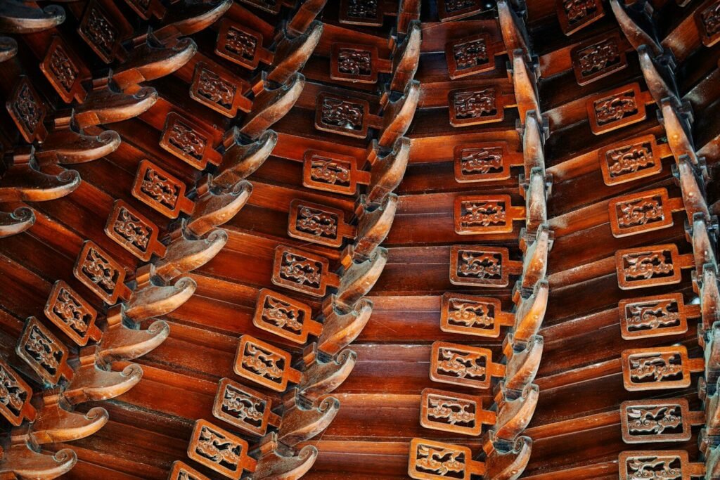 Intricate wooden ceiling with carved patterns.