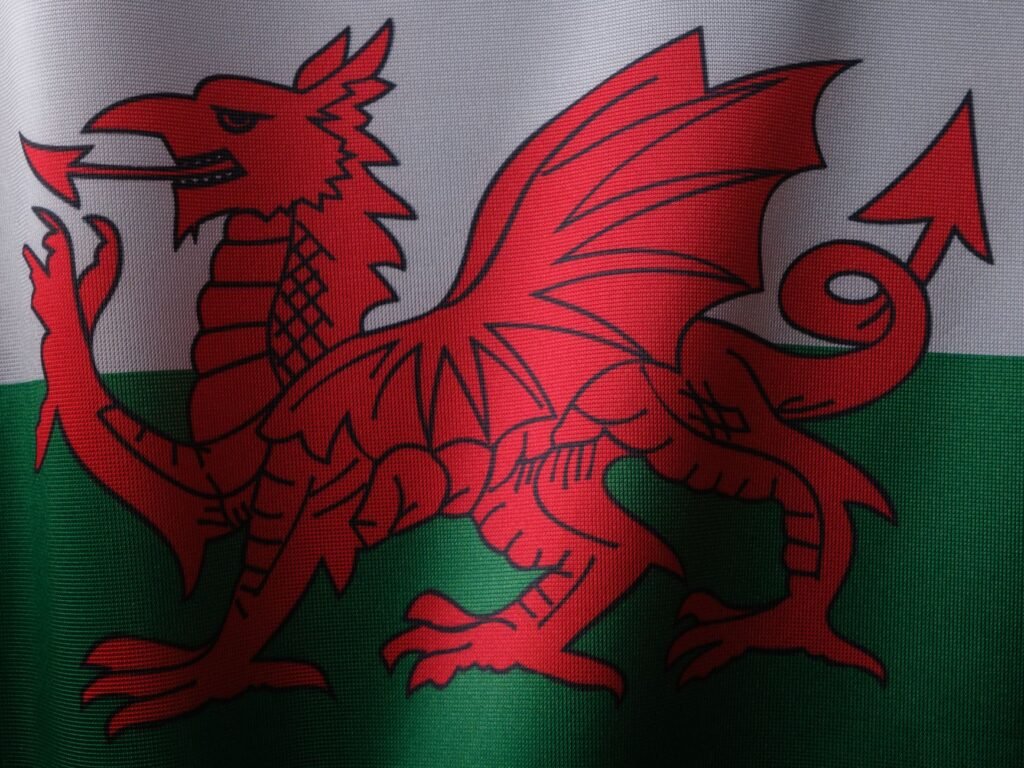 Red Welsh dragon on the flag of Wales, symbolizing Welsh mythology and the legend of Lleu Llaw Gyffes