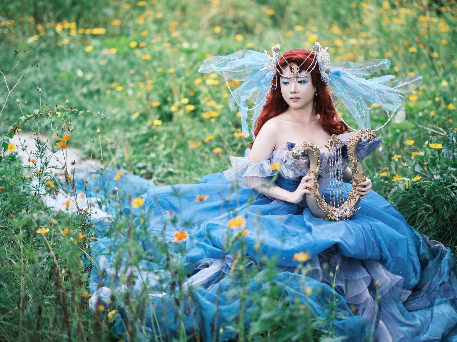 Woman in an elaborate blue gown and floral headpiece plays a harp in a flower-filled meadow, evoking Apollo lyre