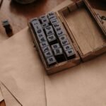 Set of alphabet rubber stamps in a wooden box on brown craft paper