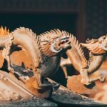 Intricate wooden sculpture of Ryujin, a mythical dragon with detailed carvings and flowing scales