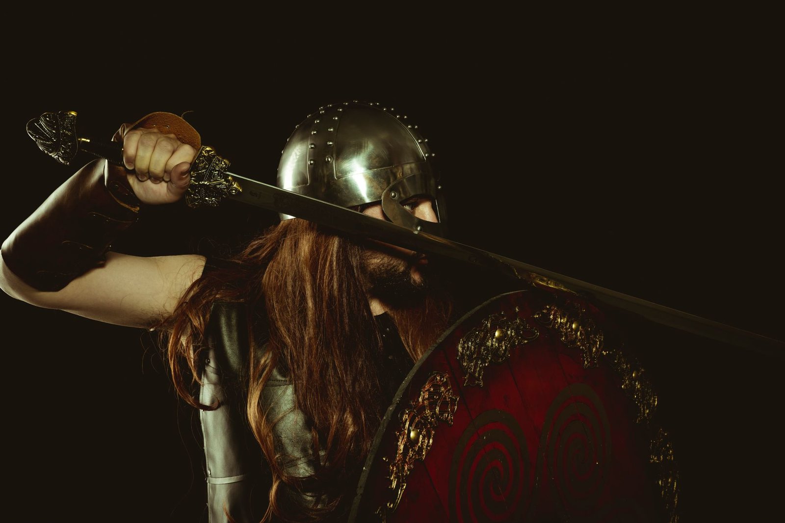 Medieval warrior with sword and shield, evoking the Aegishjalmur or helm of awe symbol of protection