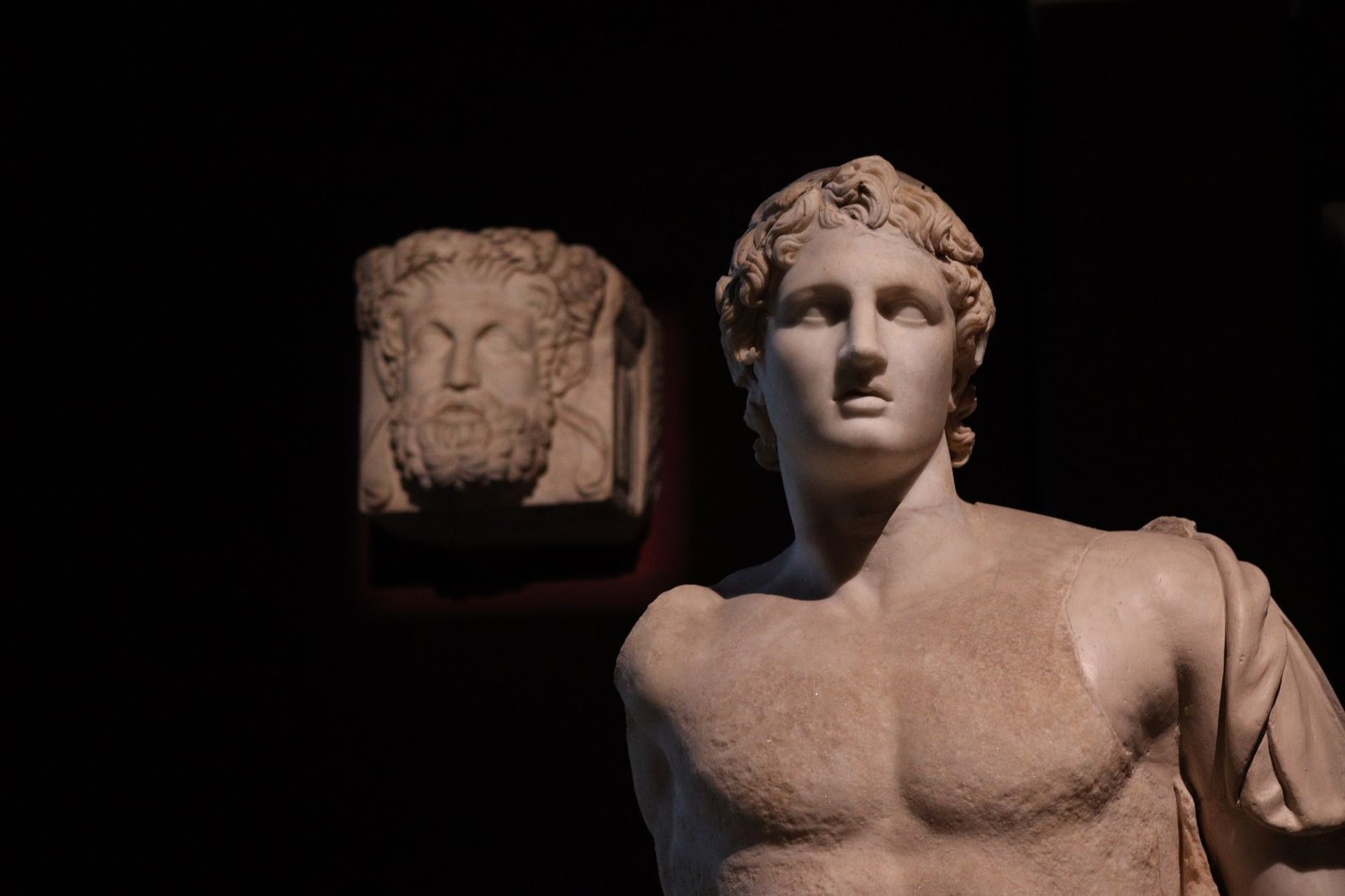Ancient Greek marble statues evoking Helios in Greek mythology and classical solar god imagery