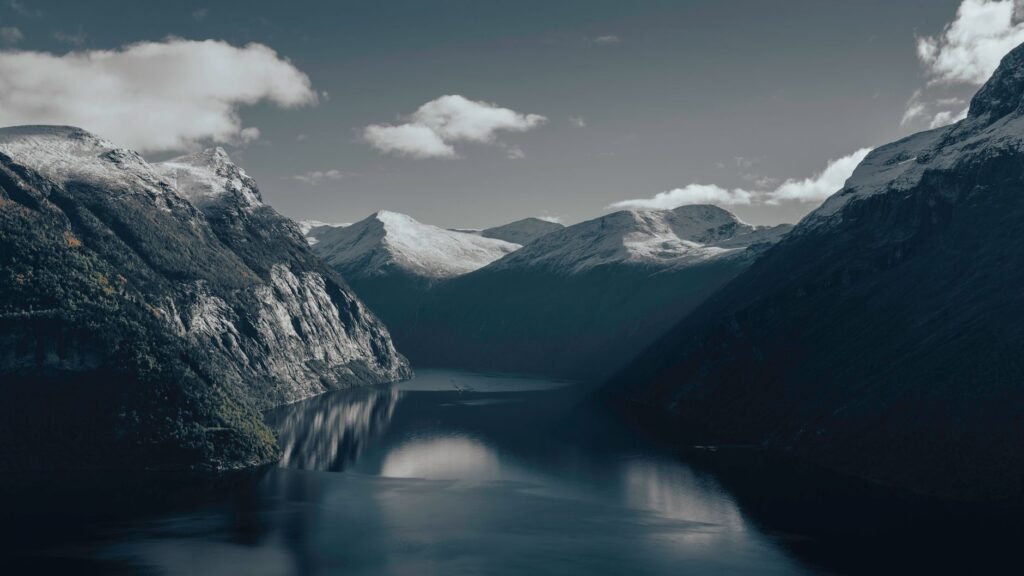 Calm fjord and snowy mountains evoke the ancient world of Ymir in Norse mythology