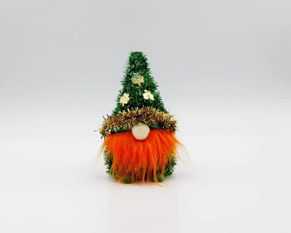 Christmas gnome with green hat and orange beard on a white background